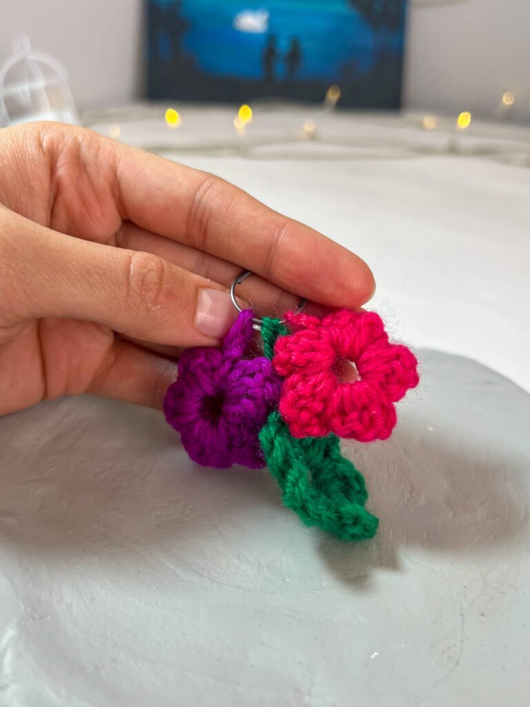 Crochet flowers on a keychain.